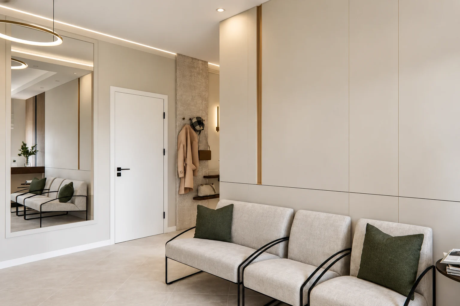 The door side of the waiting room: a large wall mirror, a white door, coat hooks on a textured strip of wall, and, on the right, light wall panels with a bronze band and waiting room chairs