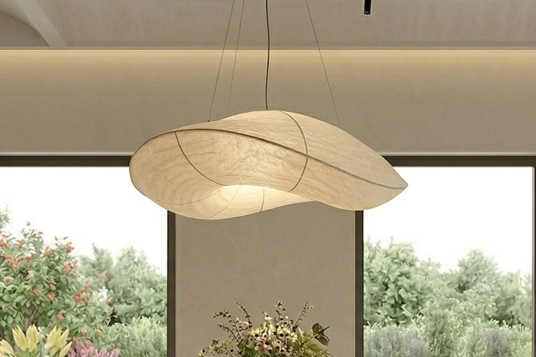 Close-up of the cloud-like, rice-paper-style pendant lamp above the dining table
