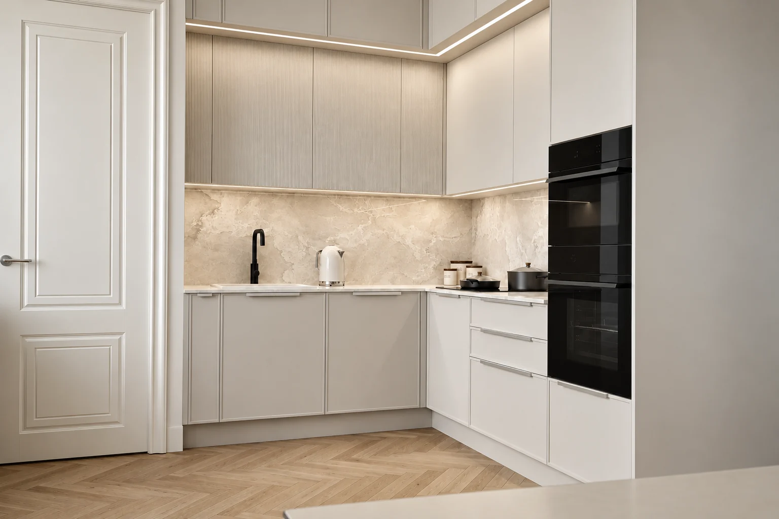 Light warm grey kitchen with finely fluted wall-unit fronts, a marble-effect splashback, a black tap and black ovens built into a tall unit, with a panelled door on the left