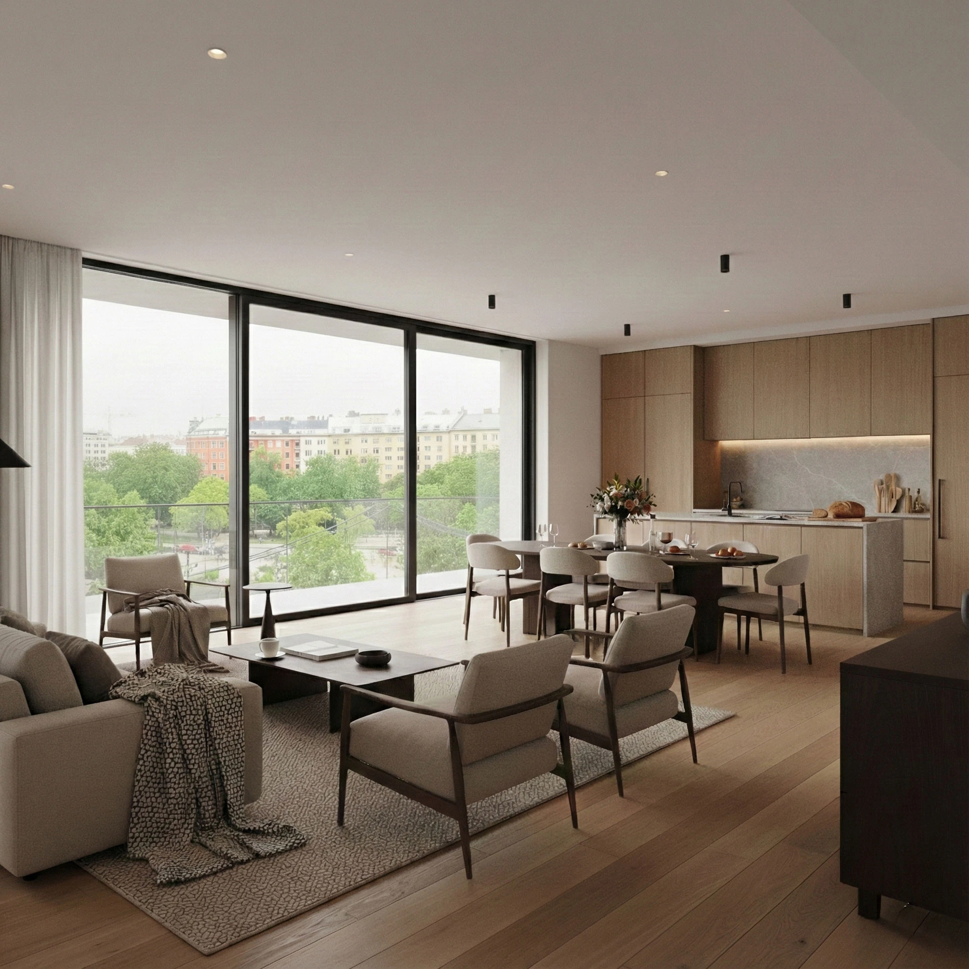 Open-plan living room, dining area and kitchen with floor-to-ceiling glazing, a beige sofa, wood-framed armchairs and wooden kitchen fronts