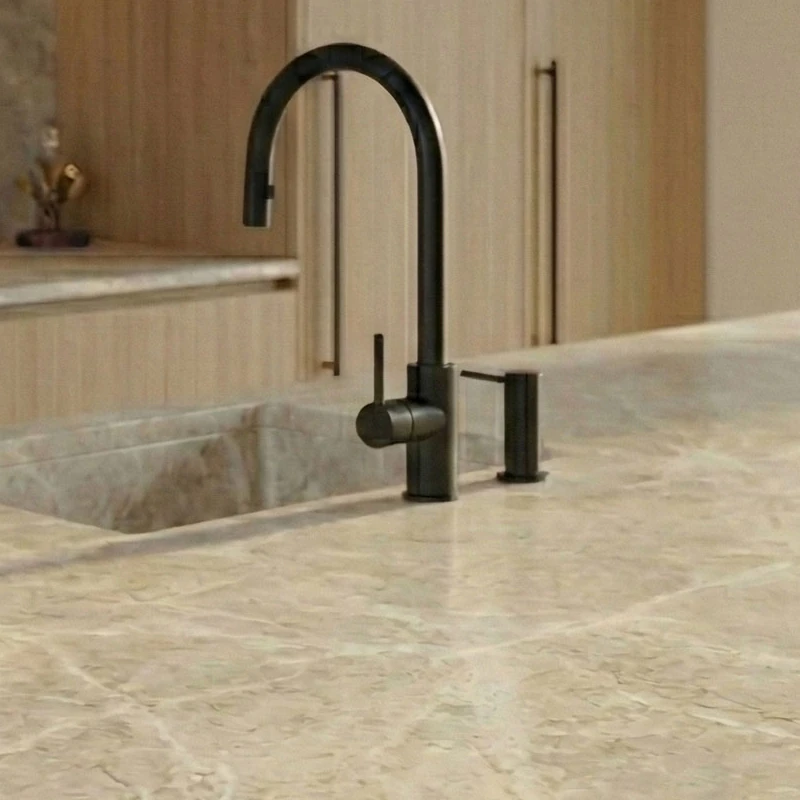 Black tap and dispenser beside a sink in the same stone effect as the worktop