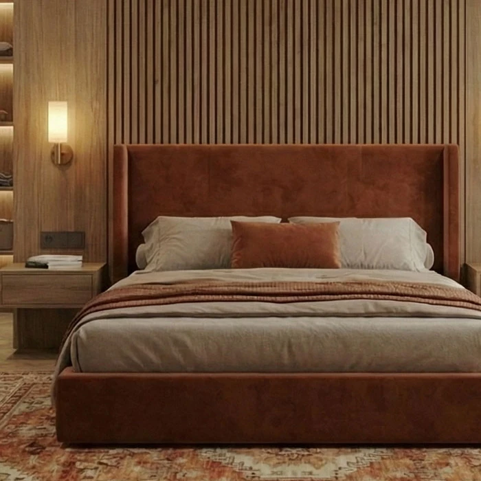 Terracotta velvet bed frame with a tall headboard in front of the wood-slatted wall
